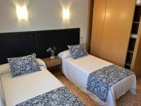 Postel nebo postele na pokoji v ubytování Hotel Ronsel