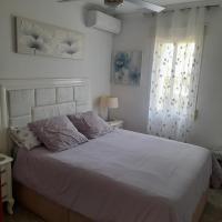 Postel nebo postele na pokoji v ubytování "EL RINCON" naturist boutique apartment
