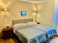 Postel nebo postele na pokoji v ubytování Hotel La Rivera
