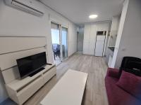 Televízia a/alebo spoločenská miestnosť v ubytovaní BONITO APARTAMENTO EN DENIA