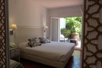 Posteľ alebo postele v izbe v ubytovaní Hotel Malaga Picasso