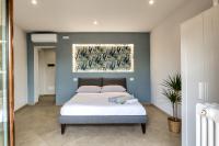 Łóżko lub łóżka w pokoju w obiekcie La Cantina Rent Rooms