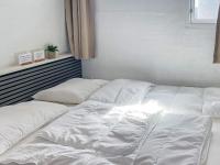 Postel nebo postele na pokoji v ubytování Apartment Brovst X