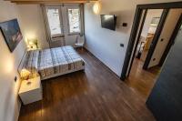 A bed or beds in a room at Case Appartamenti Vacanze Da Cien