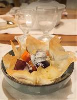 a bowl of food sitting on top of a table at Ets CAPMASIL - chambre 1920 in Virac