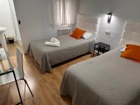Posteľ alebo postele v izbe v ubytovaní Hostal ARS