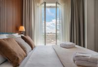 A bed or beds in a room at Hotel Universal