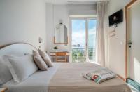 A bed or beds in a room at Hotel Universal