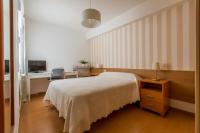 A bed or beds in a room at PR La Paz