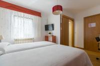 A bed or beds in a room at PR La Paz