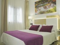Postel nebo postele na pokoji v ubytování Hotel Verol