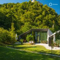 a small house on the side of a hill at Ortenia Apartments in Nature in Podčetrtek