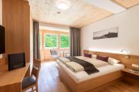 Televízia a/alebo spoločenská miestnosť v ubytovaní Rössle Appartements