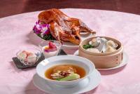 a table with two plates of food and a bowl of soup at Hotel Global View Tsuchiura in Tsuchiura