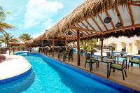 a resort with a pool and tables and chairs at Hidden Beach Resort Au Naturel Adults Only Catamarán, Cenote & More Inclusive in Akumal