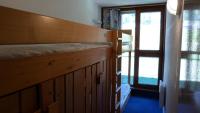 Łóżko lub łóżka w pokoju w obiekcie Résidence Tournavelles - Appartement 2 pièces 5 personnes avec vue sur les pistes, skis aux pieds et des commerces, proche de l'ESF et de la garderie dan MAE-2071