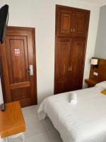 Postel nebo postele na pokoji v ubytování Hotel Venezuela
