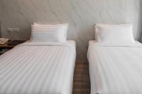 Postel nebo postele na pokoji v ubytování Bangkok City Link Hotel