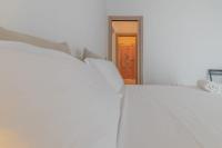 A bed or beds in a room at Italian Experience-CasAmare