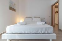 A bed or beds in a room at Italian Experience-CasAmare