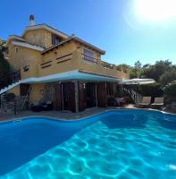 The swimming pool at or close to VILLA VITTORIA with PRIVATE HEATED SWIMMING POOL COMPLETE WITH HIDROMASSAGE FOR EXCLUSIVE USE , SEA VIEW, 150 METERS FROM THE BEACH
