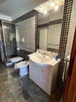 A bathroom at VILLA VITTORIA with PRIVATE HEATED SWIMMING POOL COMPLETE WITH HIDROMASSAGE FOR EXCLUSIVE USE , SEA VIEW, 150 METERS FROM THE BEACH