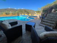 The swimming pool at or close to VILLA VITTORIA with PRIVATE HEATED SWIMMING POOL COMPLETE WITH HIDROMASSAGE FOR EXCLUSIVE USE , SEA VIEW, 150 METERS FROM THE BEACH