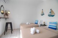 Postel nebo postele na pokoji v ubytování Babilia central appartment suites Limenas Hersonisou