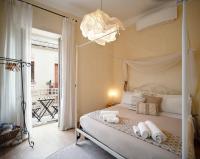 A bed or beds in a room at Ai due Mori Apt by Addler House Ospitality