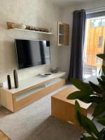 TV a/nebo společenská místnost v ubytování Apartmán Jestřáb Janské Lázně