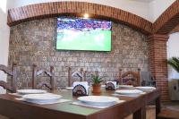 TV a/nebo společenská místnost v ubytování Hotel Cuamanco