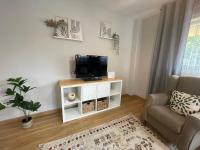Televízia a/alebo spoločenská miestnosť v ubytovaní Apartamento Villa de Cartes