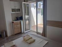 Kuchyň nebo kuchyňský kout v ubytování Apartments and rooms Camelia