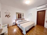 Postel nebo postele na pokoji v ubytování Room Tai - Spacious and Comfy with Private Terrace