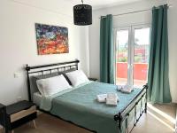 A bed or beds in a room at Lime House Corfu