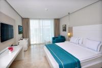 Postel nebo postele na pokoji v ubytování Lugga Boutique Hotel & Beach