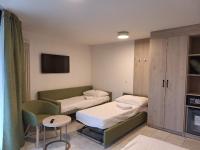 Postel nebo postele na pokoji v ubytování Hotel Nessi Locarno