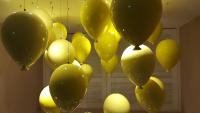 a bunch of yellow balloons in a room at Travel Art Inn in Chiayi City
