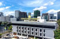 a building with a sign on top of it in a city at Cebu Quincentennial Hotel in Cebu City