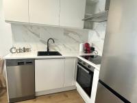 Kuchyňa alebo kuchynka v ubytovaní Beach apartment IV Coeur de Plage