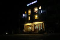 a building at night with lights in the windows at Winnie Homestay in Longtian