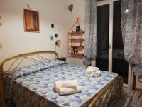 Postel nebo postele na pokoji v ubytování La casa del Capitano, l'uomo e il mare ...