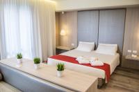 A bed or beds in a room at Hotel Atlantico