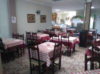 A restaurant or other place to eat at Hostal Virgen Del Rocío