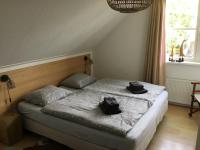Postel nebo postele na pokoji v ubytování Beach Villa Makkum met sauna