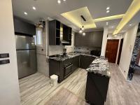 Kuchyň nebo kuchyňský kout v ubytování Ultra modern & cozy 2BD apartment