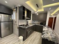 Kuchyň nebo kuchyňský kout v ubytování Ultra modern & cozy 2BD apartment