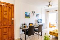 A television and/or entertainment centre at Costamar Oceanview By Dream Homes Tenerife