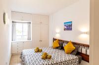 A bed or beds in a room at Costamar Oceanview By Dream Homes Tenerife