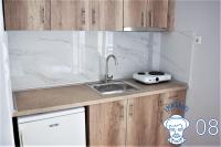 Kuchyň nebo kuchyňský kout v ubytování Emmanuel Apartments
